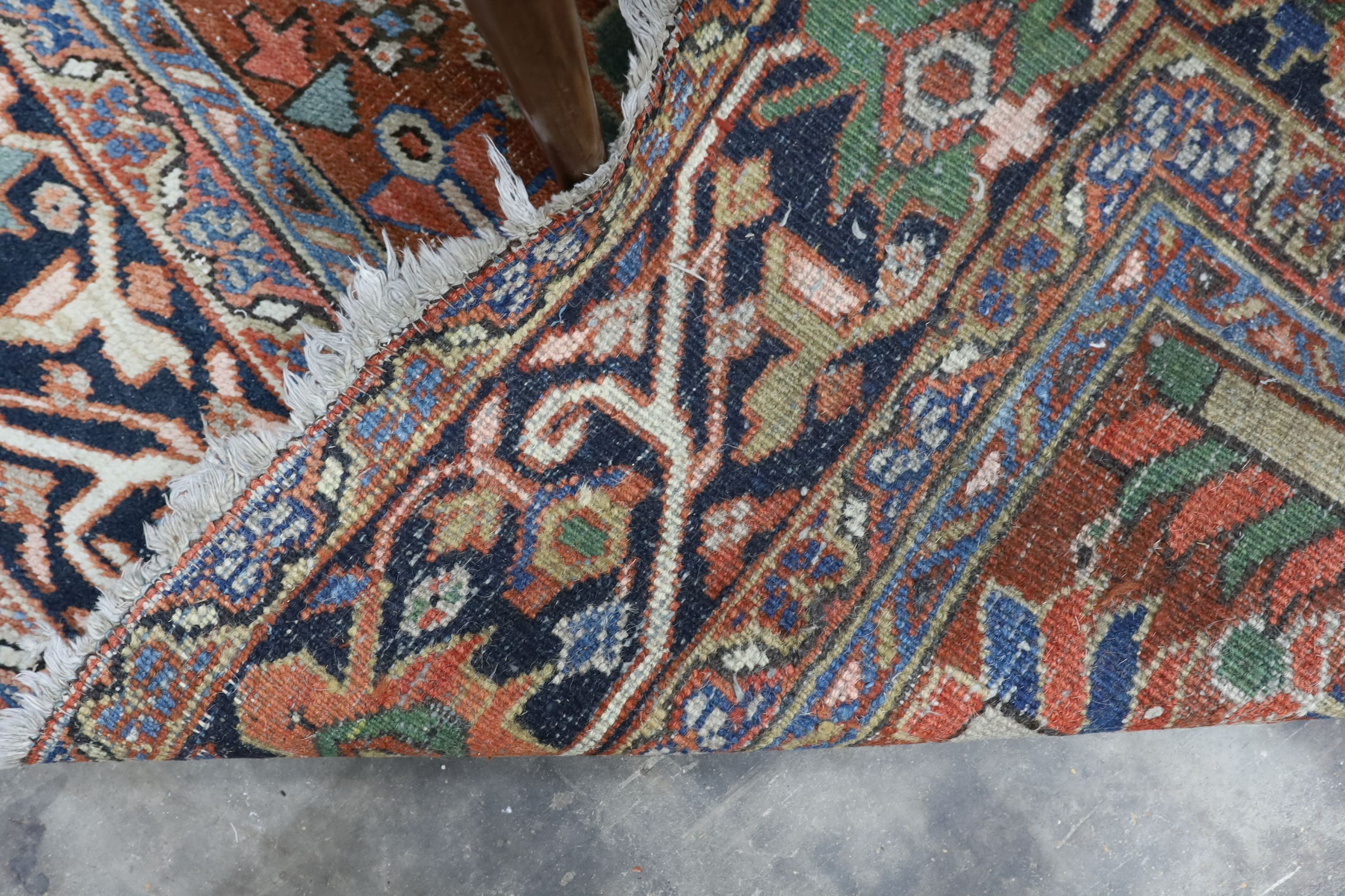 A Caucasian red ground carpet, 390 x 285cm